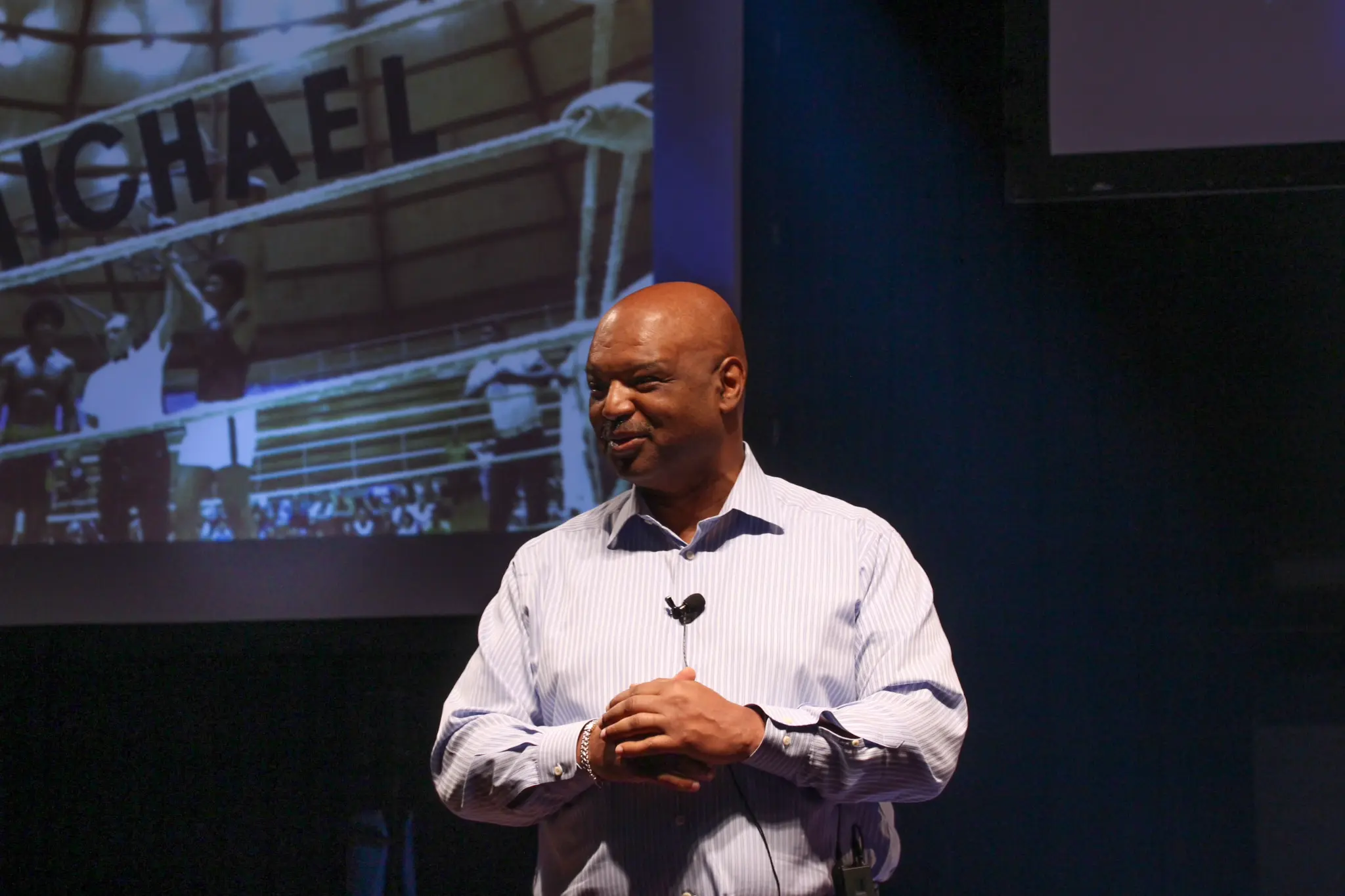 Michael Dinkins speaking on stage